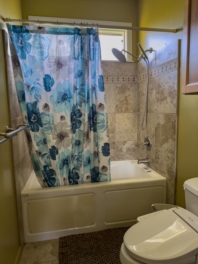 full bath featuring shower / tub combo, tile patterned flooring, and toilet