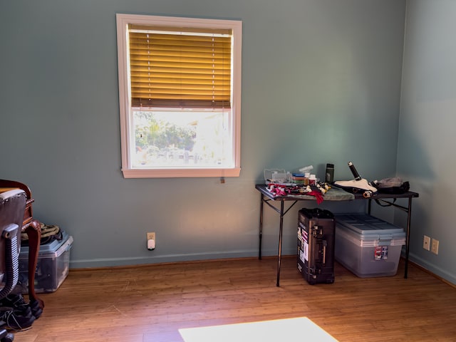 miscellaneous room with baseboards and wood finished floors