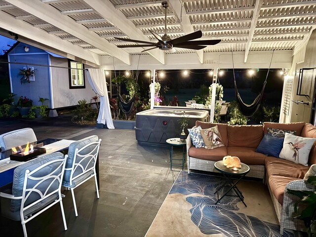 view of patio with an outdoor living space with a fire pit and a ceiling fan