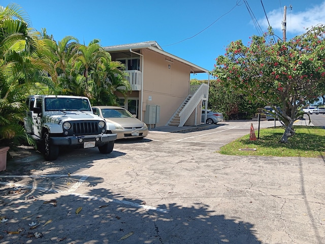 uncovered parking lot featuring stairway