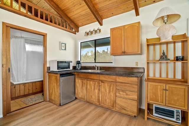4620 Anolani St, Kapaa, HI 96746 - kitchen with wooden ceiling, stainless steel dishwasher, white microwave, light wood-style flooring, and a sink