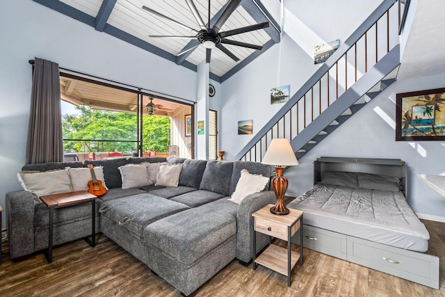 living area featuring ceiling fan, stairs, wooden ceiling, wood finished floors, and high vaulted ceiling