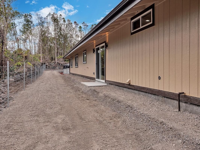 view of property exterior with fence