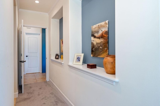 corridor with tile patterned flooring, crown molding, baseboards, carpet flooring, and recessed lighting