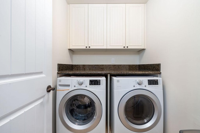 laundry area featuring cabinet space and independent washer and dryer