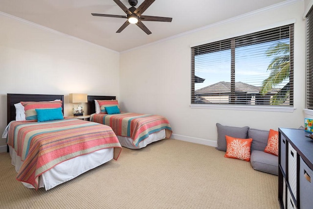 carpeted bedroom with crown molding, a ceiling fan, and baseboards