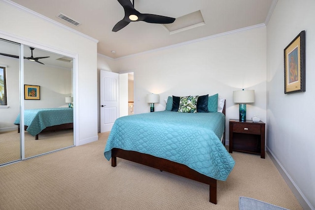 bedroom featuring visible vents, light colored carpet, attic access, and ornamental molding