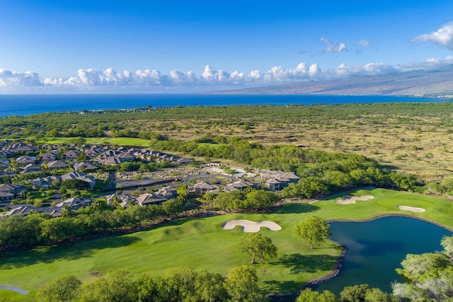 birds eye view of property featuring view of golf course and a water view