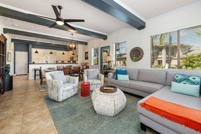 living area with ceiling fan with notable chandelier, beam ceiling, light tile patterned floors, and crown molding