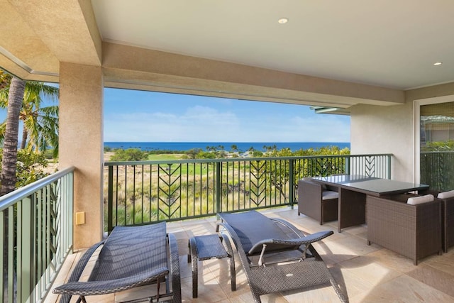 balcony featuring a water view