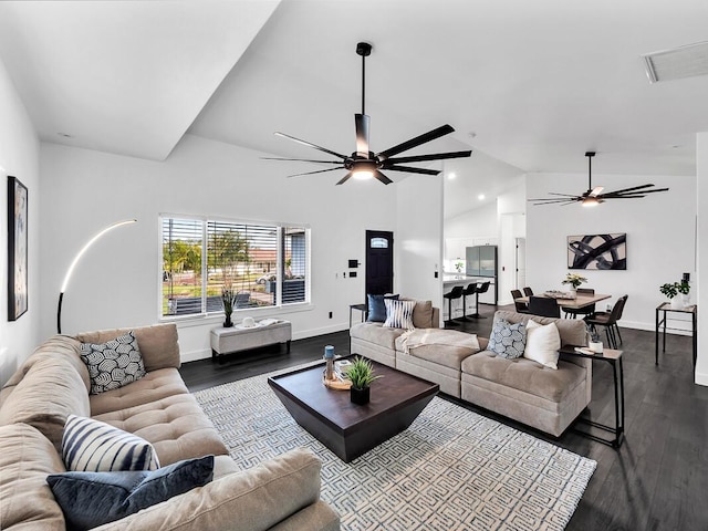 living room featuring ceiling fan, visible vents, baseboards, and dark wood-style flooring