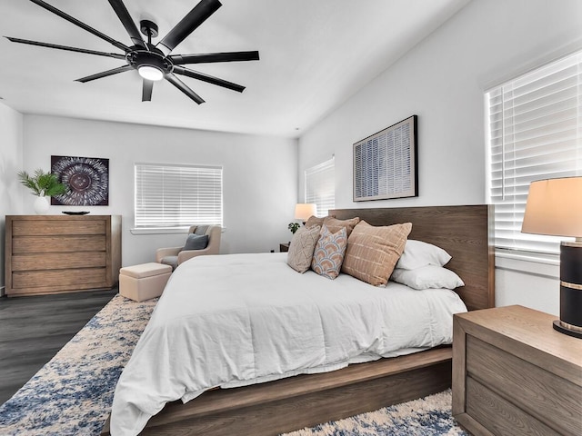 bedroom with a ceiling fan and wood finished floors