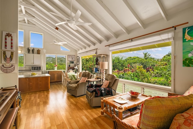 sunroom featuring plenty of natural light and beamed ceiling