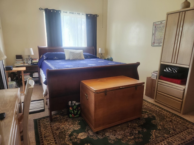 bedroom featuring dark carpet