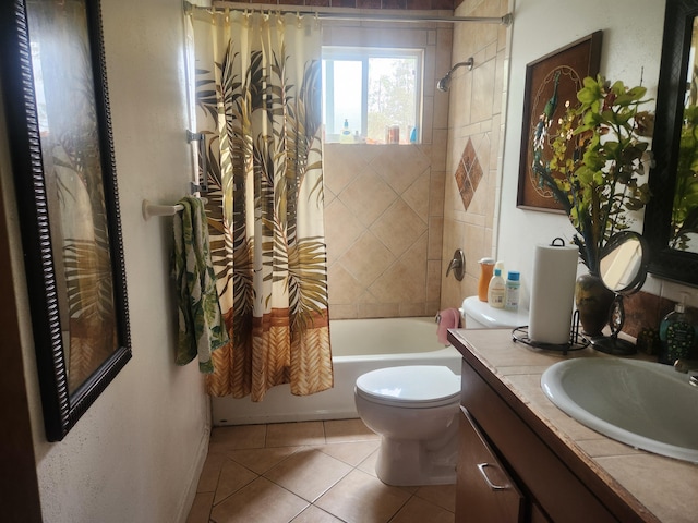 bathroom featuring tile patterned flooring, shower / tub combo with curtain, vanity, and toilet