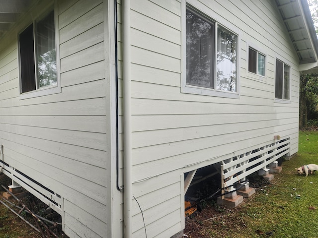 view of side of home with crawl space