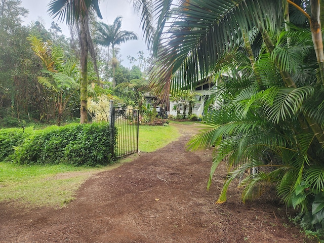 view of home's community featuring a gate