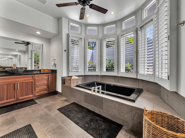 full bath featuring recessed lighting, a ceiling fan, a bath, and vanity