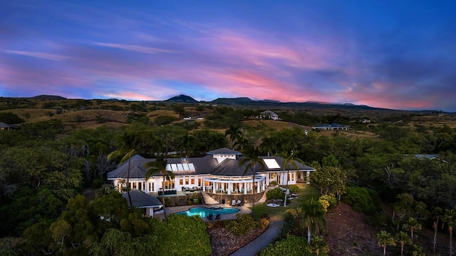 birds eye view of property featuring a mountain view