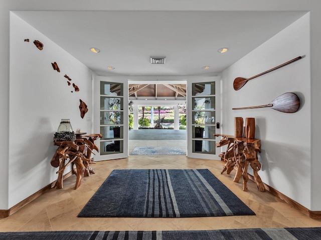 interior space with baseboards and visible vents