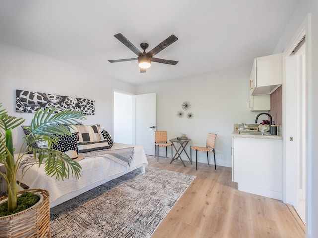 bedroom featuring light wood-type flooring and ceiling fan