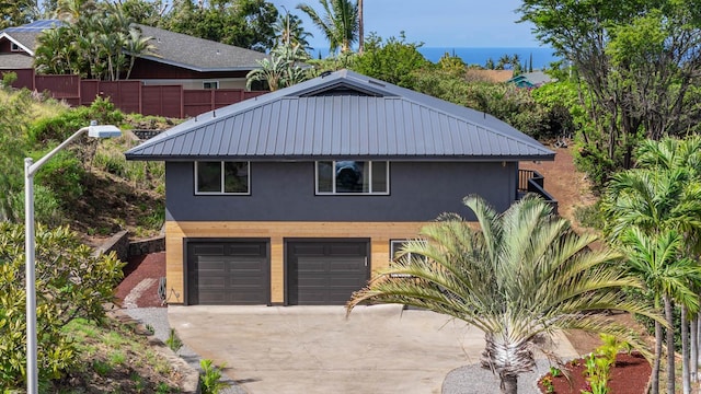 exterior space with driveway and fence