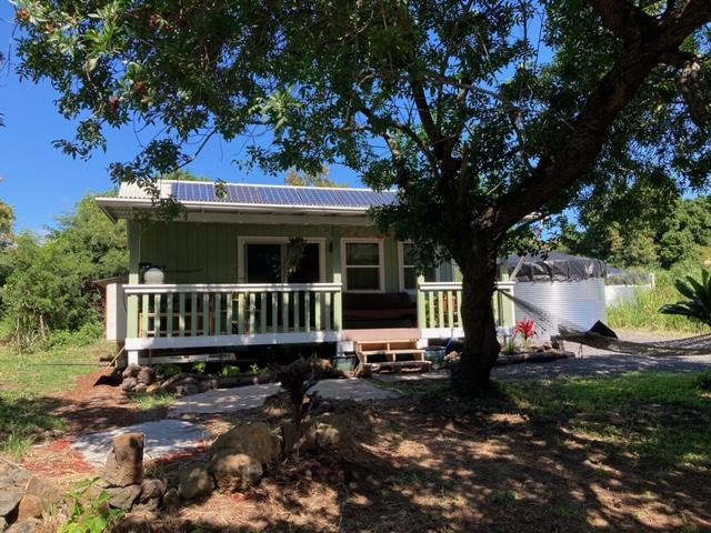 rear view of house featuring covered porch