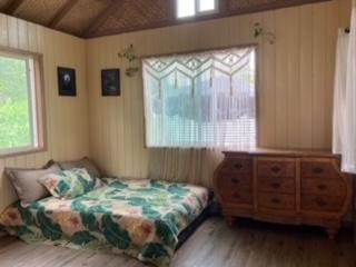 bedroom featuring lofted ceiling and wood finished floors