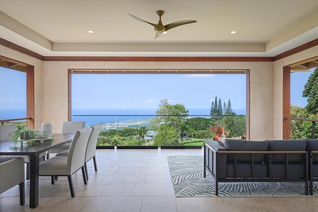 interior space with ceiling fan