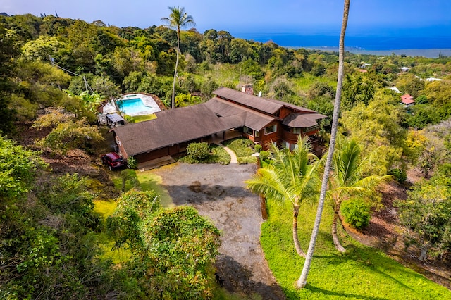 aerial view featuring a wooded view