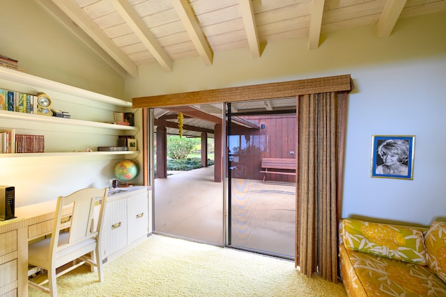 home office featuring lofted ceiling with beams, carpet floors, built in desk, and wood ceiling