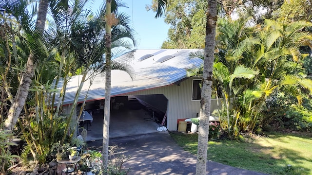 exterior space with a carport and driveway