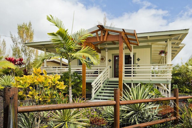 view of front of home featuring stairway