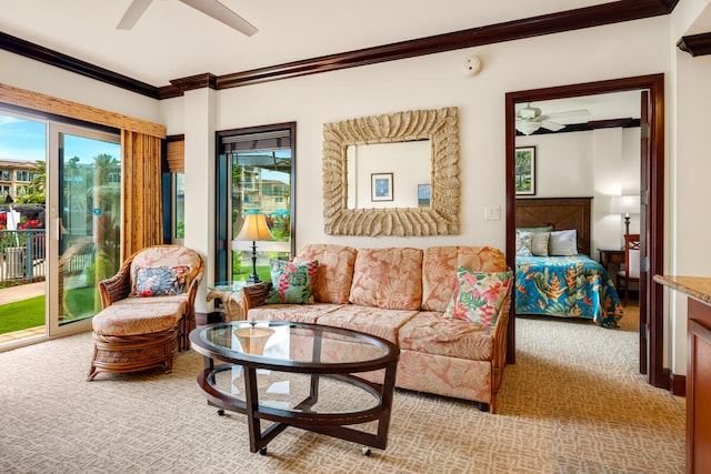 carpeted living room featuring crown molding and ceiling fan