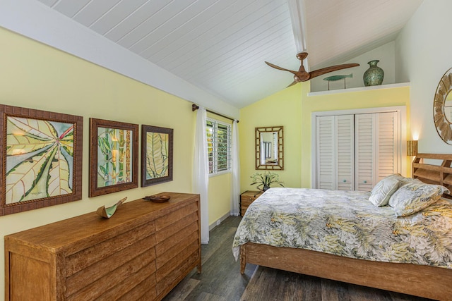 bedroom featuring a ceiling fan, dark wood finished floors, a closet, wood ceiling, and vaulted ceiling