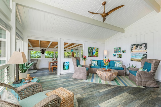 sunroom with vaulted ceiling with beams and a ceiling fan