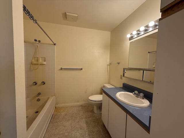 full bathroom featuring tile patterned flooring, baseboards, toilet, bathing tub / shower combination, and vanity