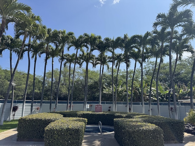 view of sport court with fence