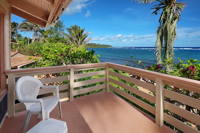 balcony featuring a water view