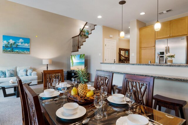 carpeted dining room featuring recessed lighting and visible vents