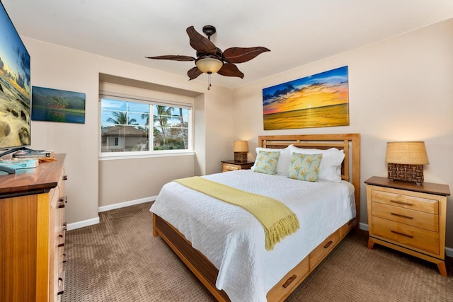 carpeted bedroom with a ceiling fan and baseboards