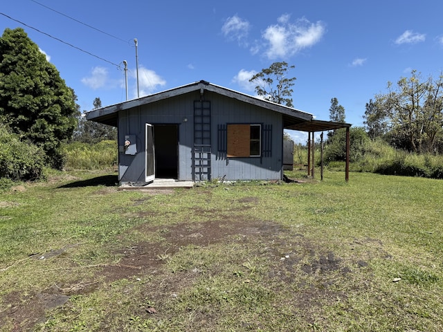 view of outdoor structure featuring an outbuilding and a carport