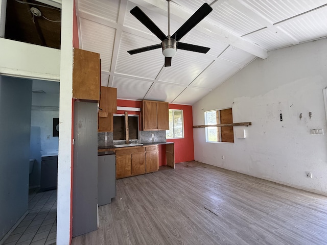 kitchen featuring a ceiling fan, lofted ceiling with beams, tasteful backsplash, light wood-style floors, and brown cabinetry