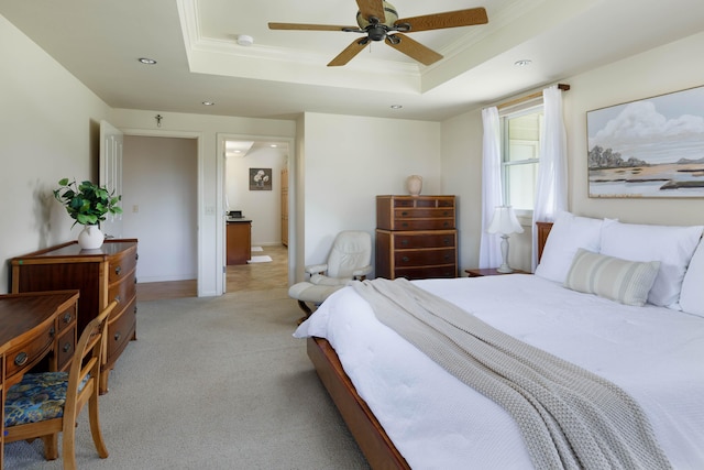 bedroom with light colored carpet, ornamental molding, recessed lighting, a ceiling fan, and a tray ceiling