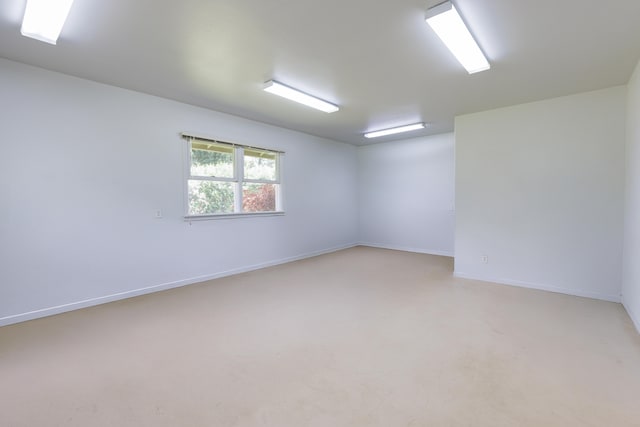 empty room with baseboards