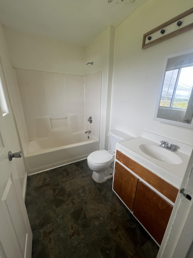bathroom featuring toilet, vanity, and bathtub / shower combination