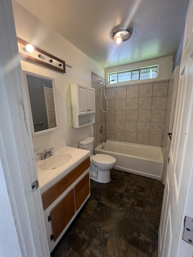 full bath with shower / bathtub combination, toilet, and vanity