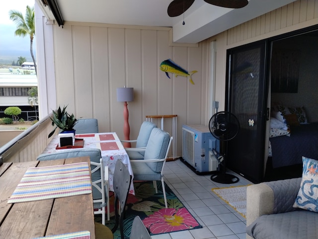 exterior space featuring tile patterned flooring and ceiling fan