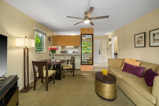 carpeted living room featuring a ceiling fan