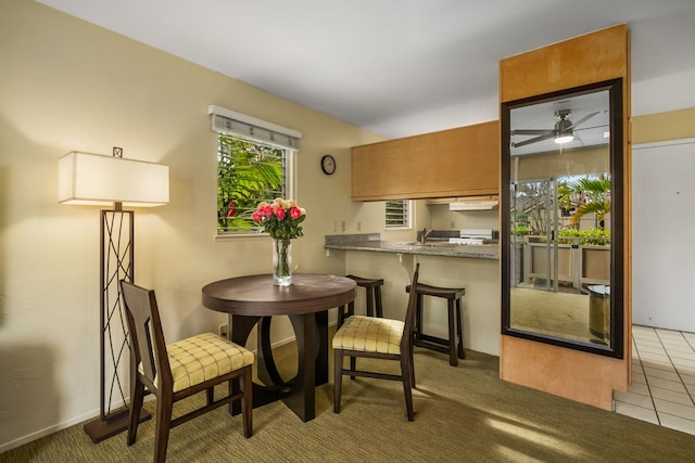 tiled dining space featuring a sink